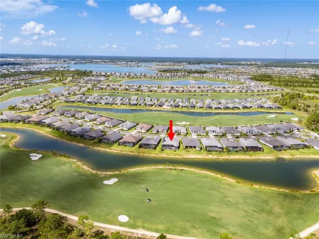 Drone / aerial view featuring a water view, a residential view, and golf course view