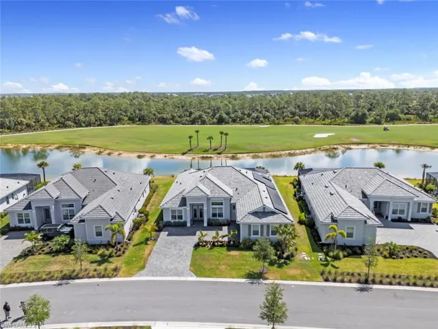 Bird's eye view with view of golf course and a water view