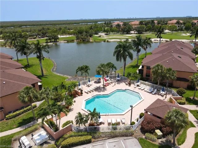 View of pool featuring a water view and a patio area