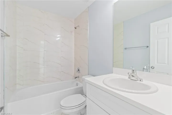 Full bathroom featuring shower / bath combination and vanity