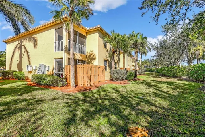 View of side of property with a yard