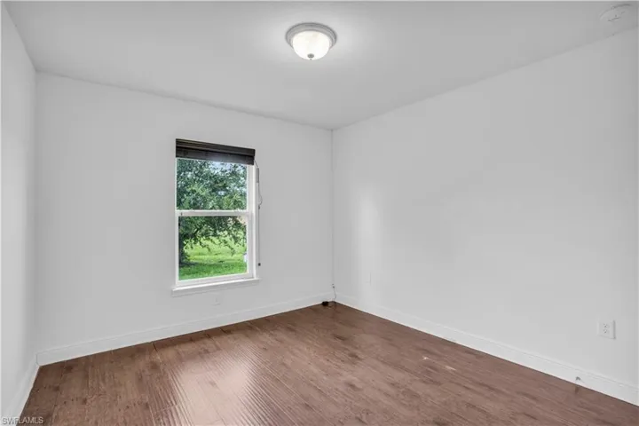 Unfurnished room with wood-type flooring