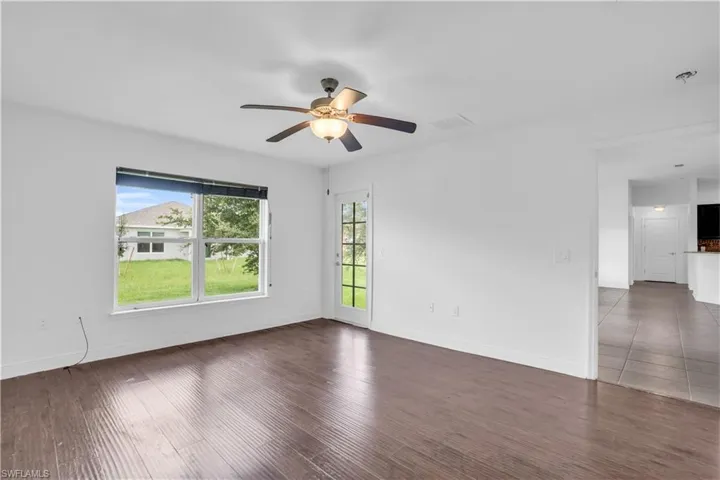 Spare room with ceiling fan and hardwood / wood-style floors