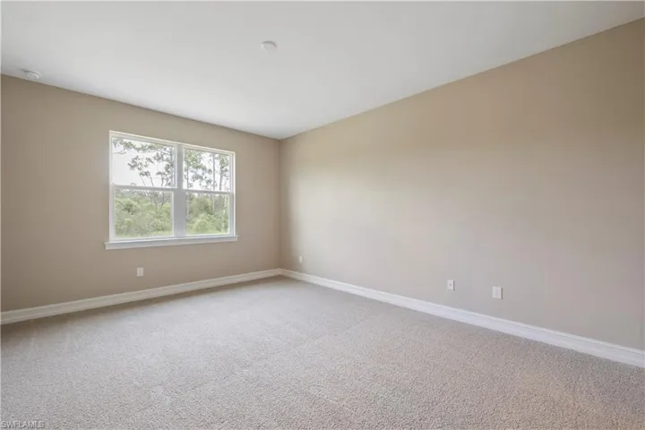 Empty room featuring carpet