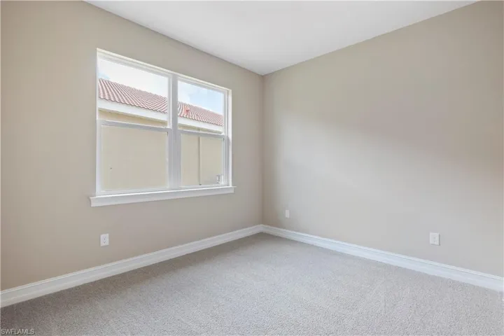 Unfurnished room featuring carpet floors