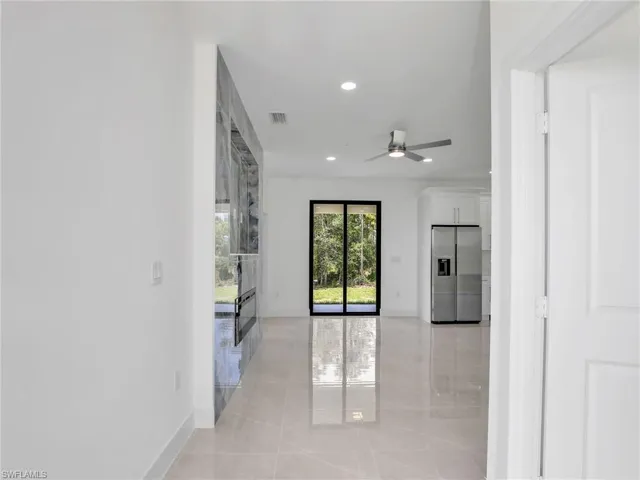 Spare room with recessed lighting, light tile patterned flooring, and ceiling fan