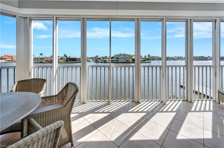 Sunroom with a water view