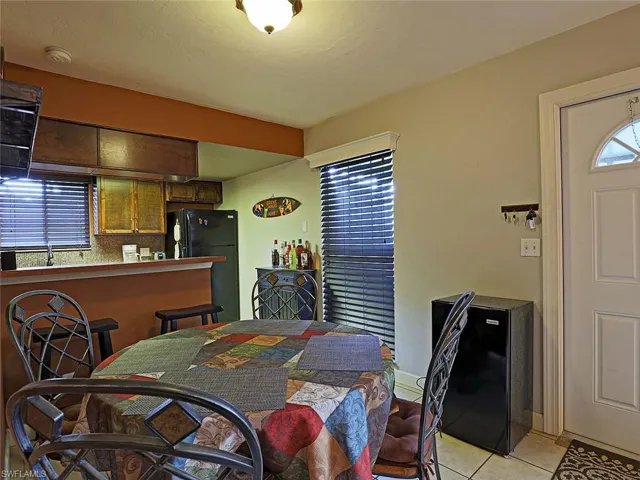 Dining room with light tile patterned floors