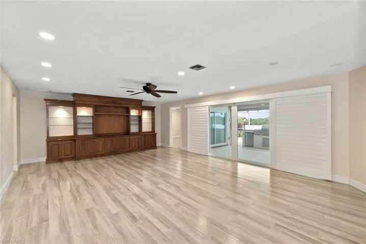 Unfurnished living room with light wood-type flooring, recessed lighting, and ceiling fan