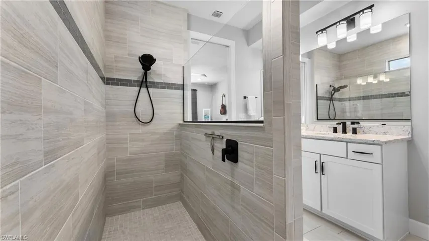 walk in shower, floor to ceiling ceramic tile