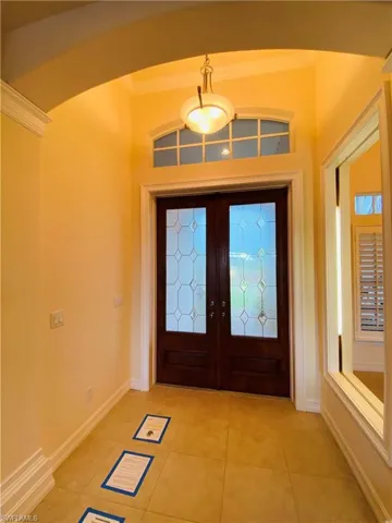 The FOLLOWING PICS ARE FROM the UNFURNISHED RENTAL LISTING BEFORE the TENANT OCCUPANCY:   View of Textured Glass Double Door Entry Foyer featuring Frame View of Formal Dining