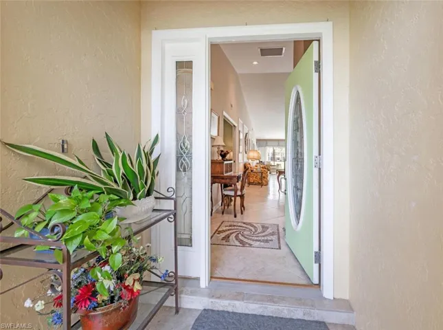 Doorway to property with visible vents