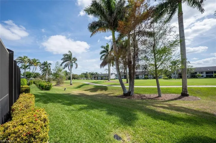 View of community featuring a lawn and a residential view