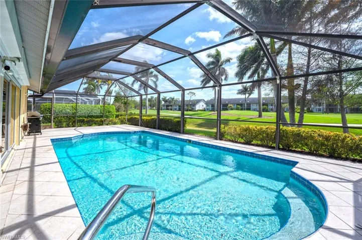 Pool featuring grilling area, a lanai, and a patio