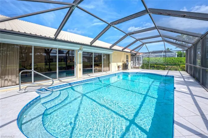 Outdoor pool featuring a lanai and a patio area