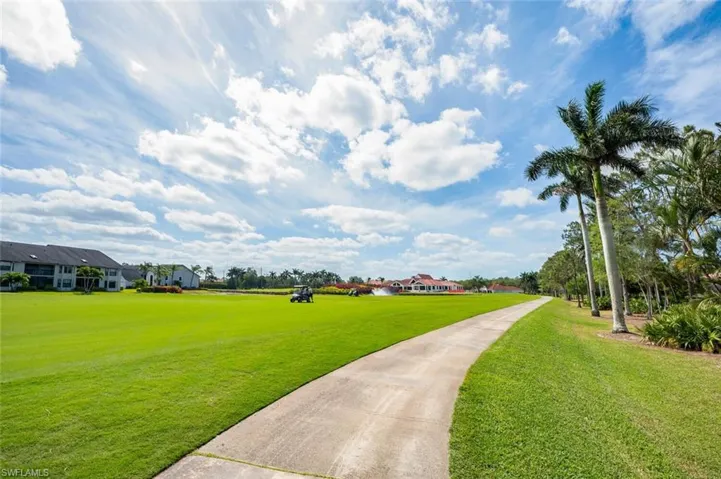 View of community featuring a residential view and a yard