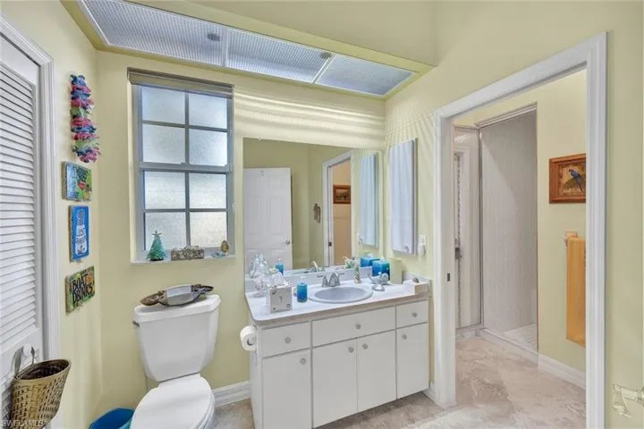 Bathroom featuring vanity and a shower