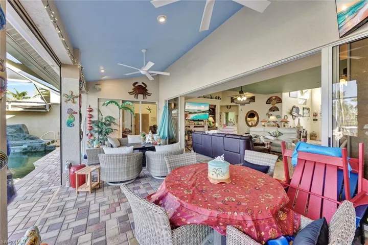 View of patio / terrace with ceiling fan, an outdoor living space, and outdoor dining area