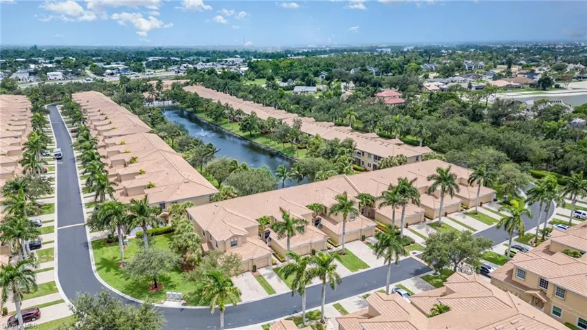 Aerial perspective of suburban area with a large body of water