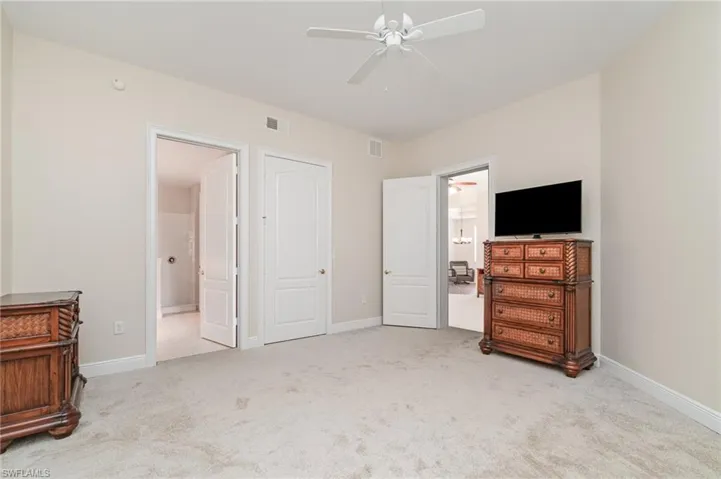 Bathroom with walk in shower, light tile patterned floors, and recessed lighting