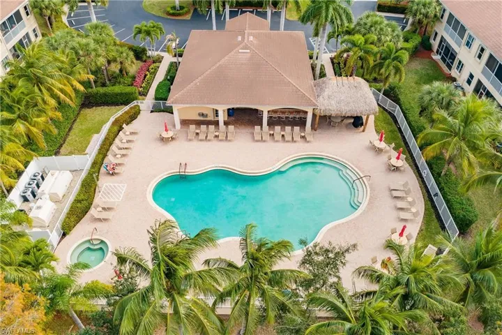 Community pool with a patio