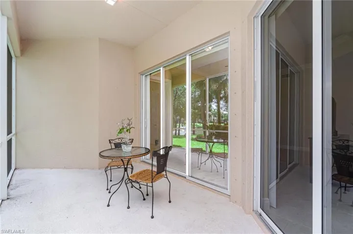 Screened lanai featuring a water view
