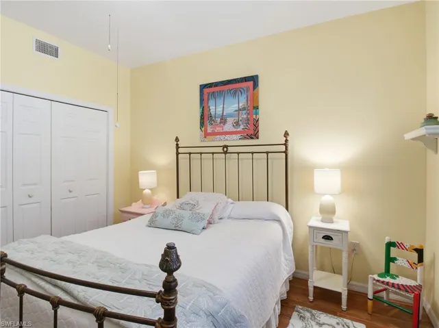 Bedroom with a closet and wood finished floors
