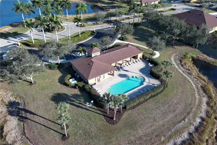 View of property location with a nearby body of water and a pool