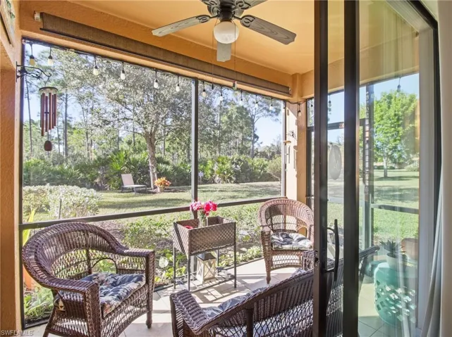 Sunroom / solarium featuring ceiling fan