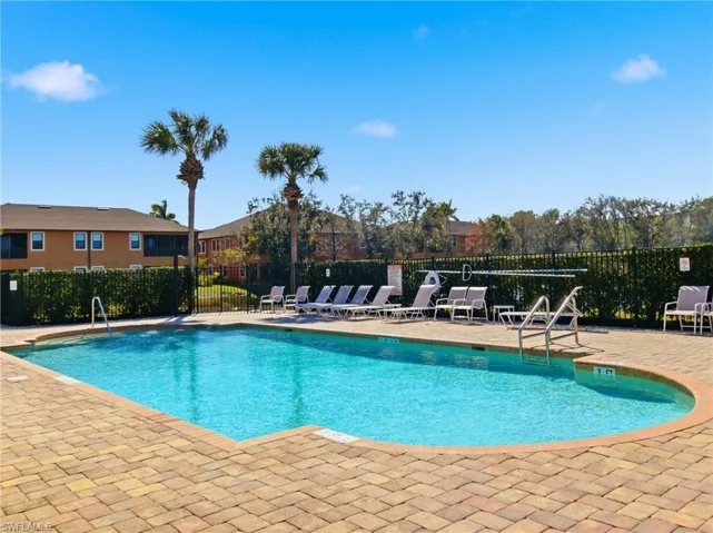 Community pool featuring a patio
