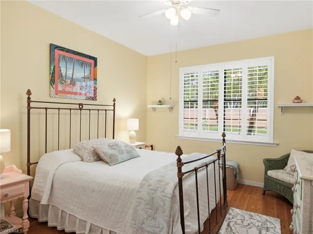 Bedroom featuring wood finished floors and ceiling fan