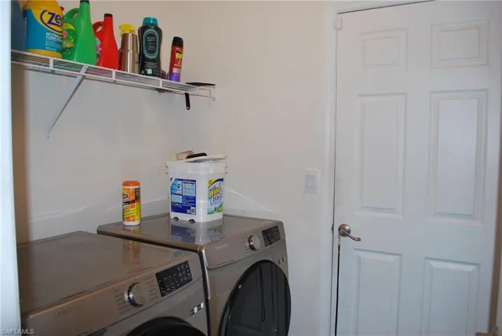 Laundry room with washing machine and dryer