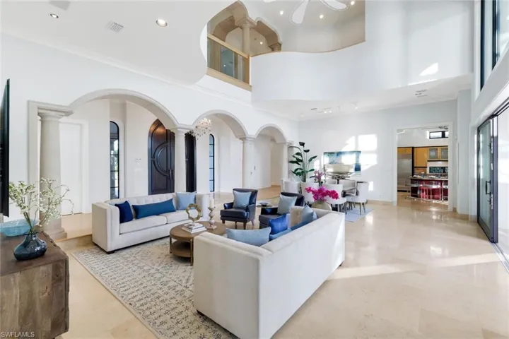 Great room featuring a high ceiling and recessed lighting