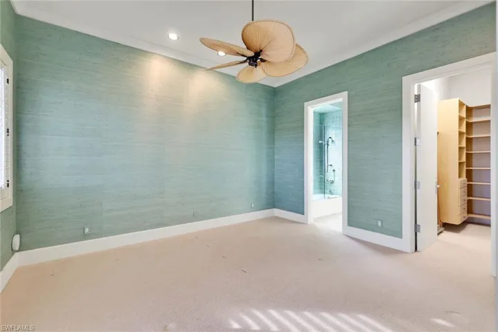 Carpeted spare room with wallpapered walls, recessed lighting, and ceiling fan