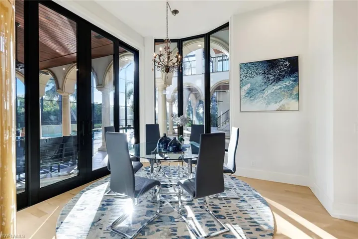 Breakfast nook with chandelier and plenty of natural light