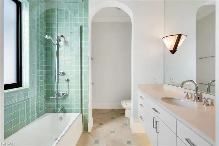 Bathroom featuring hand glazed tile