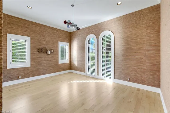 Spare room featuring plenty of natural light, recessed lighting, and wallpapered walls