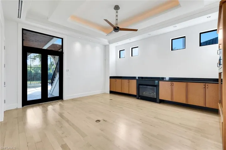 Family room featuring healthy amount of natural light, and a tray ceiling