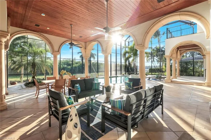 View of patio featuring outdoor lounge area, a ceiling fan, and an outdoor pool