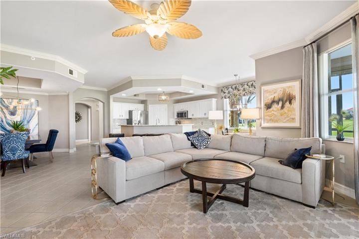 open living space flows beautfully from the kitchen, living space, formal dining.Tray ceilings, crown moldingarched doorways, tile on the diagonal.