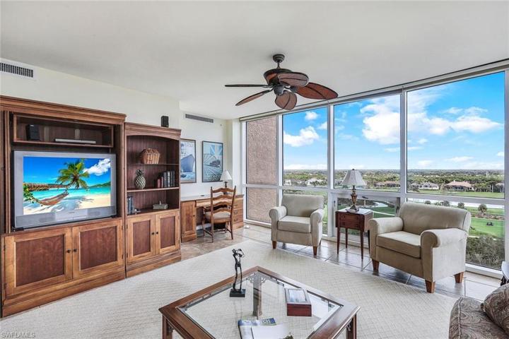 This cozy family room  is conveniently open to the kitchen area.