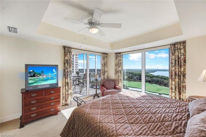 Primary bedroom also opens to the screened balcony.