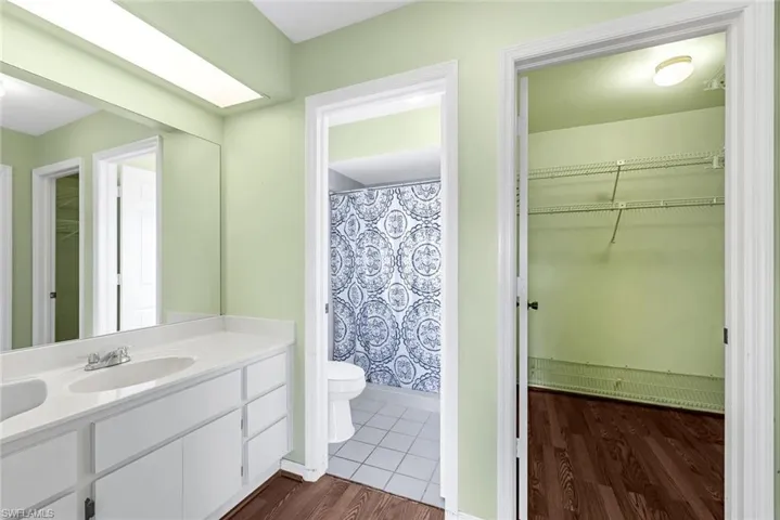 Bathroom with vanity, toilet, and tile patterned floors