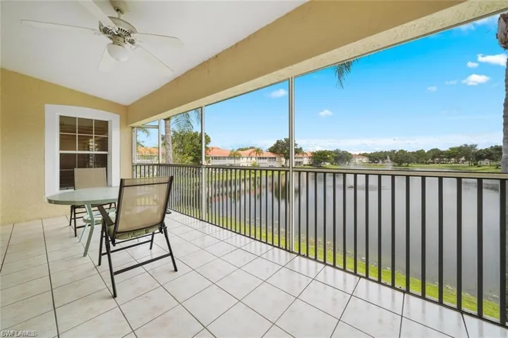 Lanai featuring ceiling fan and a water view