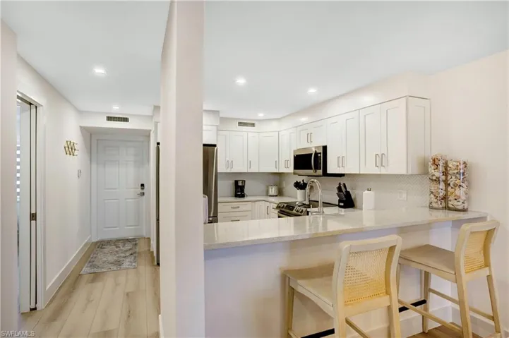 Pompeii Quartz by Vicostone in kitchen and both baths, and breakfast bar.
