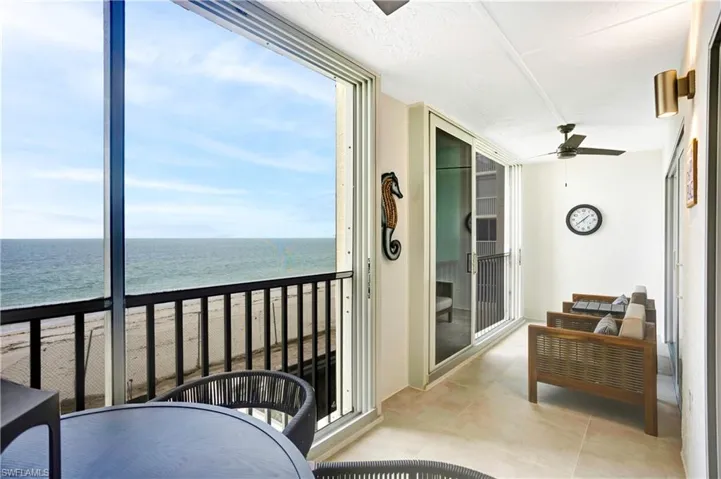 Tiled balcony with impact doors/screens...2nd floor advantage...soft Gulf breezes and sounds of the rolling waves!!!