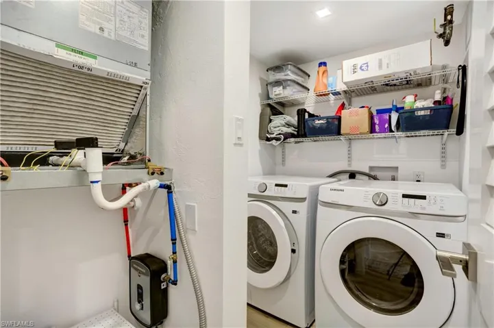 Laundry room with Upgraded Electrical Panel, new On Demand Water Heater, new Washer/Dryer, and A/C 2022!