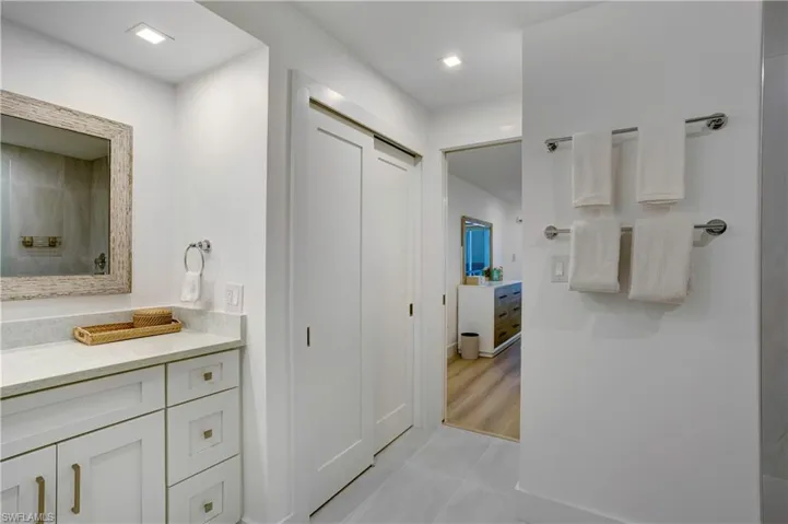 Sugar Sand and a Mix of large format porcelain and marble tile.