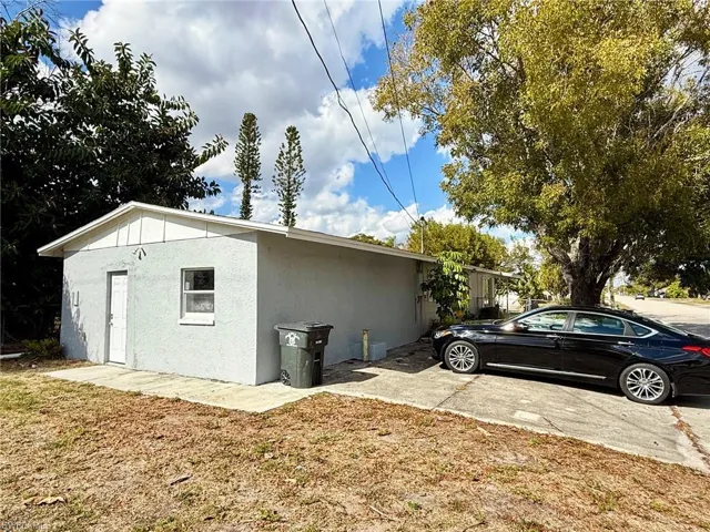 View of property exterior with stucco siding