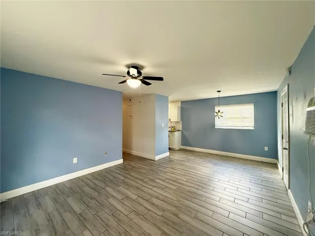 Unfurnished room featuring light wood finished floors and ceiling fan